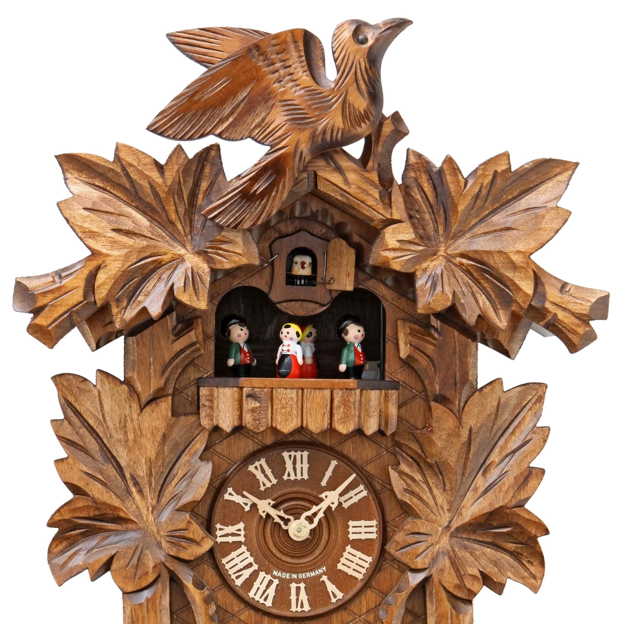 Carved 8-day musical cuckoo clock with large carved cuckoo bird and fi ...