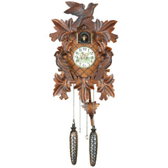 Carved battery-powered musical cuckoo clock with birds and leaves 35 cm by Trenkle Uhren