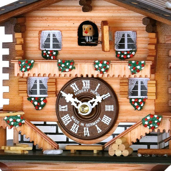  Cuckoo Clock - Chalet 1-day cuckoo clock in Swiss chalet style complete with flowers, curtains and log piles 20cm by Hubert Herr - Cuckoo Collections